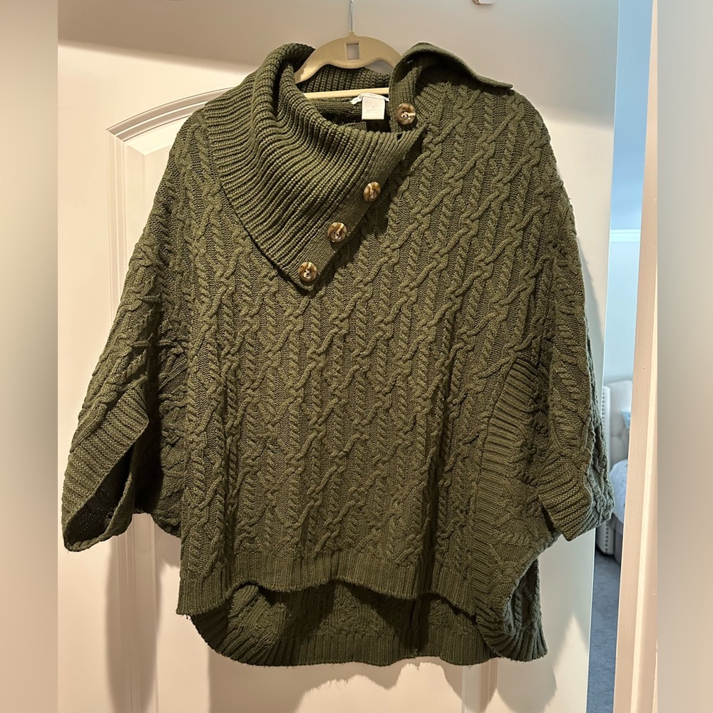 Olive colored poncho from Stitch Fix with closed closed sides and arm slots